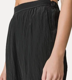 forte_forte flared trousers in satin noir^ Pants
